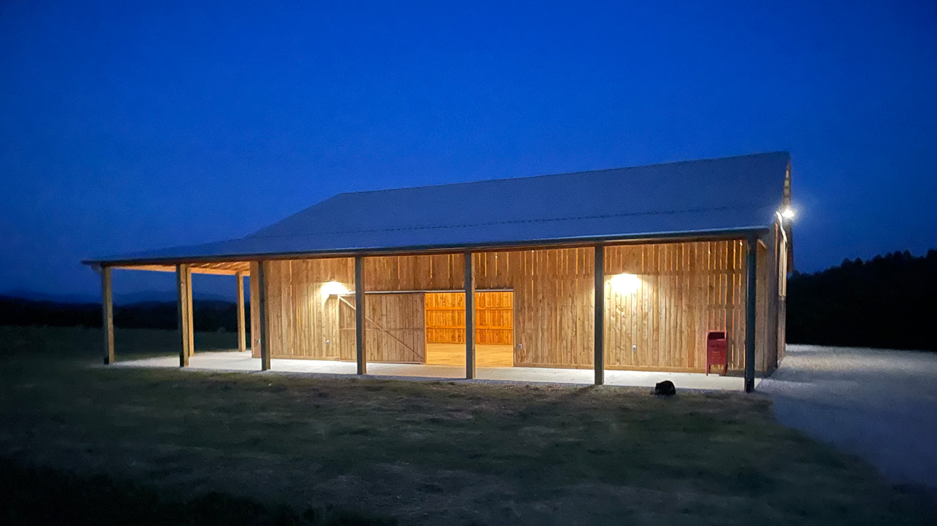 The Watershed Farm's Barn floors are concrete with 4 large doors that open on all sides for an indoor/outdoor dining/party experience