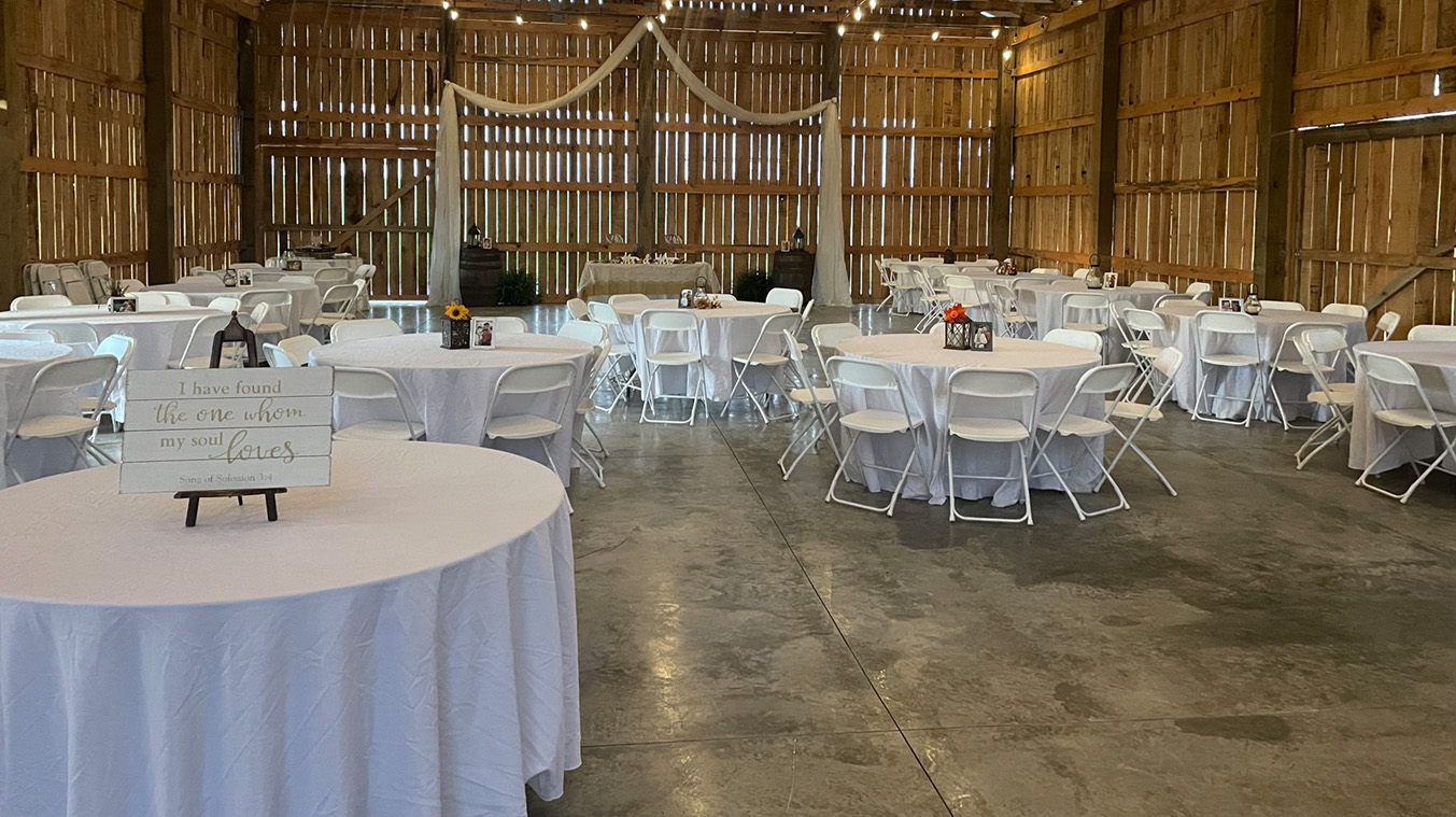 Watershed Farm's Barn floors are concrete with 4 large doors that open on all sides for an indoor/outdoor dining/party experience