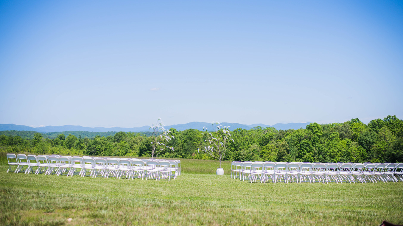 Chairs set up for wedding overlooking the Mountains